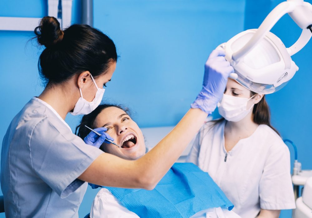 dentists-with-a-patient-during-a-dental-intervention-.jpg